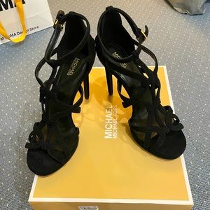 Size 8.5 Michael Kors black platform heels.  New. Never worn.